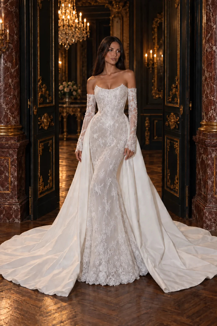 Robe Aurore vue de face : sirène en dentelle perlée, bustier sans bretelles, manches longues en dentelle et surjupe de satin en traîne